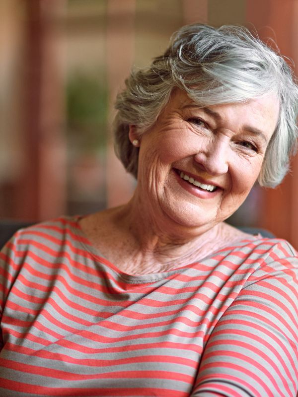 Home Care in Piedmont, CA (1) Smiling senior woman relaxing comfortably at home in Piedmont, CA