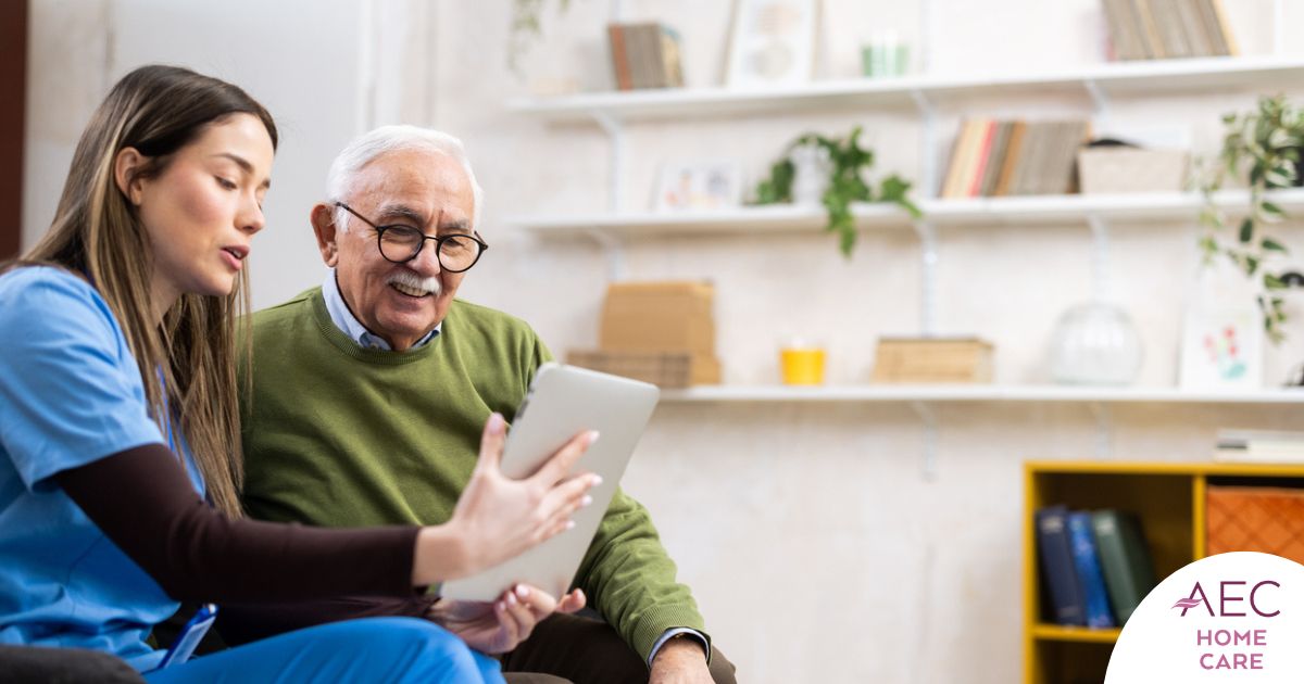 Home caregiver assisting senior man to use telehealth and senior care
